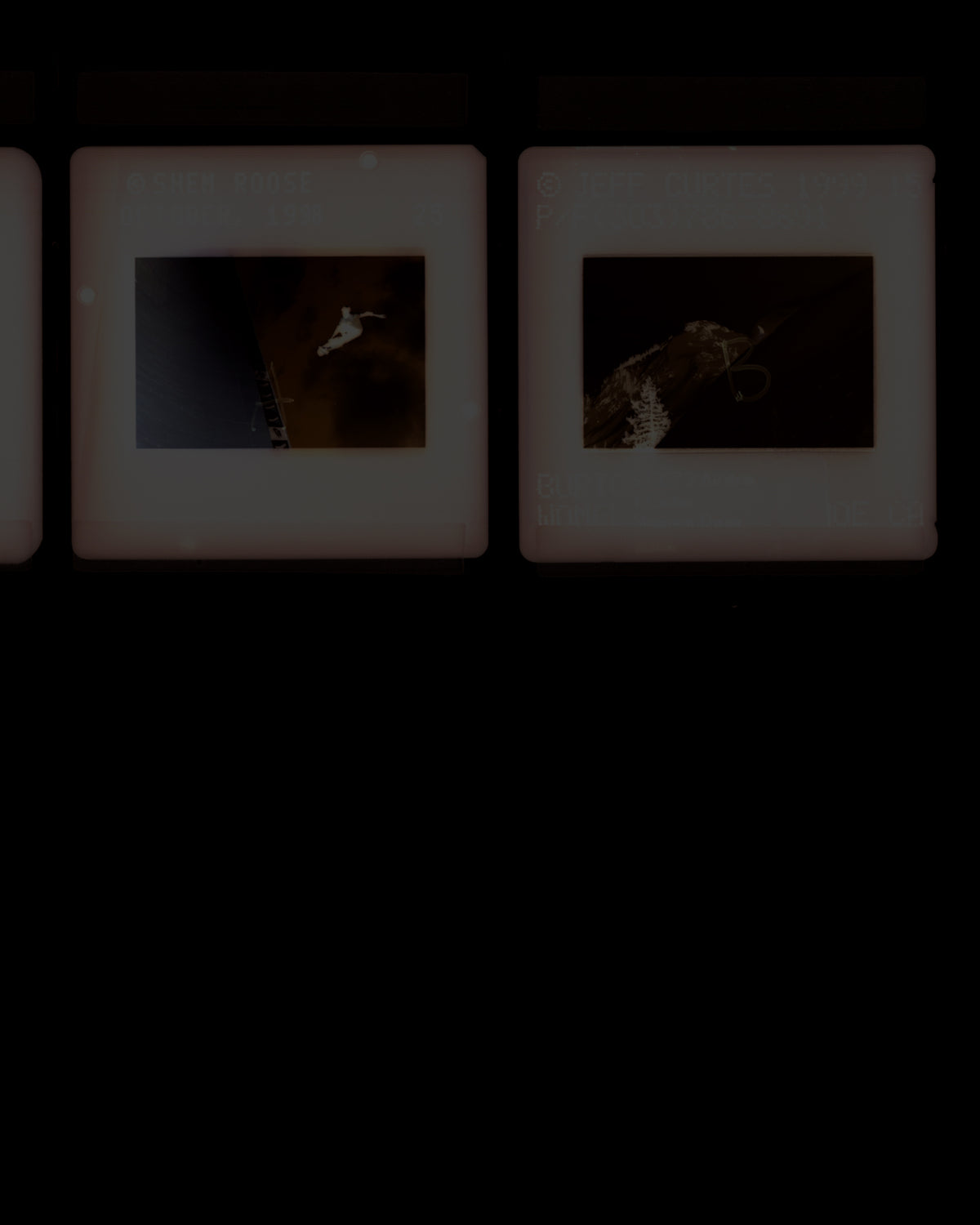 A row of vintage slide photographs with cream-colored borders, displayed against a dark background.