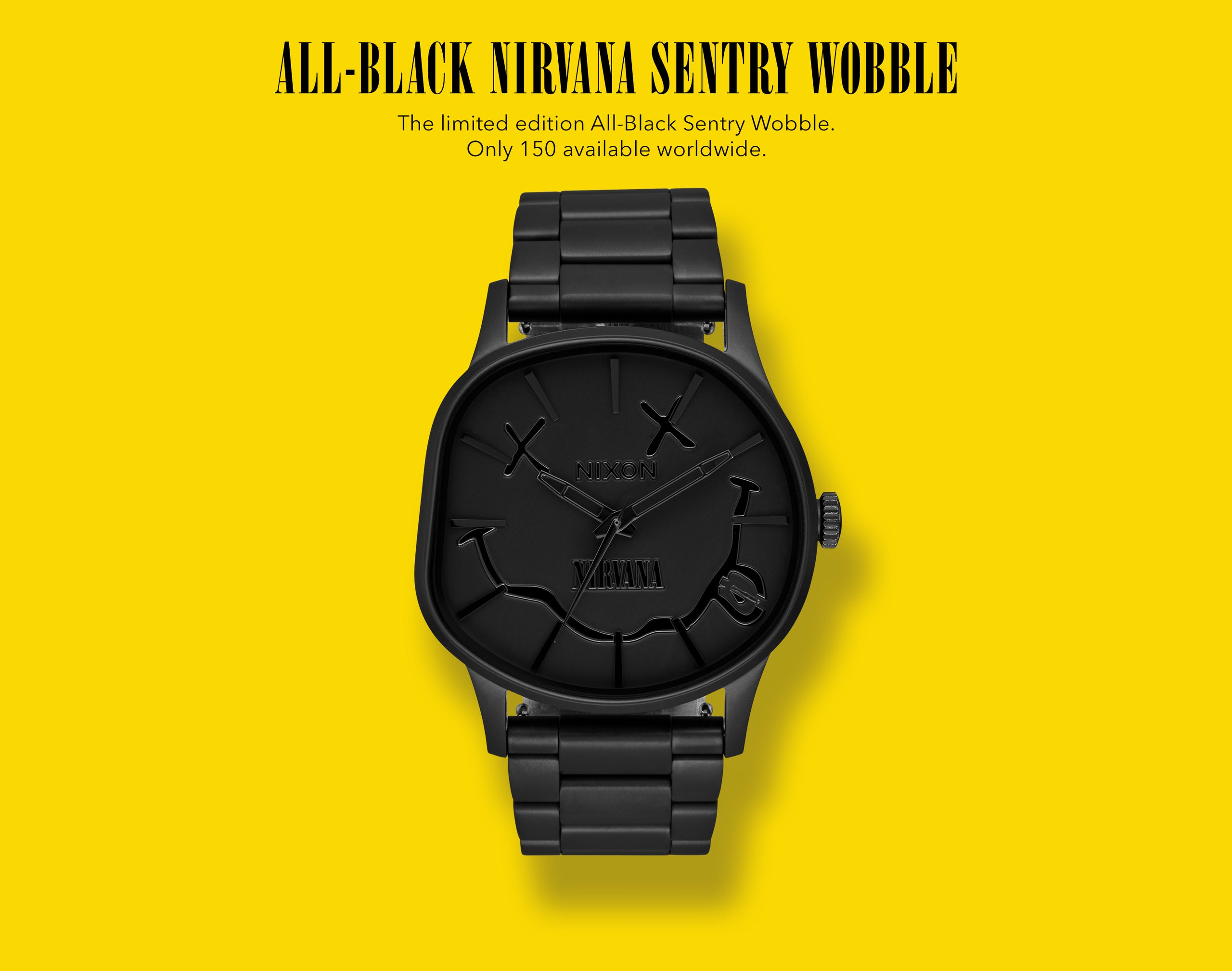 All-black Nixon Sentry Wobble watch with Nirvana smiley face logo on a bright yellow background.