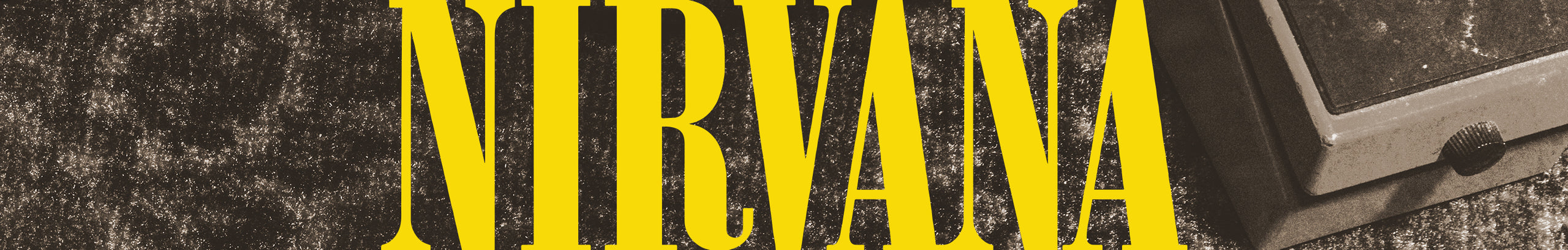 Distressed yellow "NIRVANA" logo on a dark, textured background with a partial view of a guitar pedal.