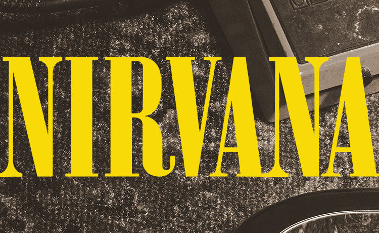 Yellow "NIRVANA" logo over a dark, textured amplifier surface.